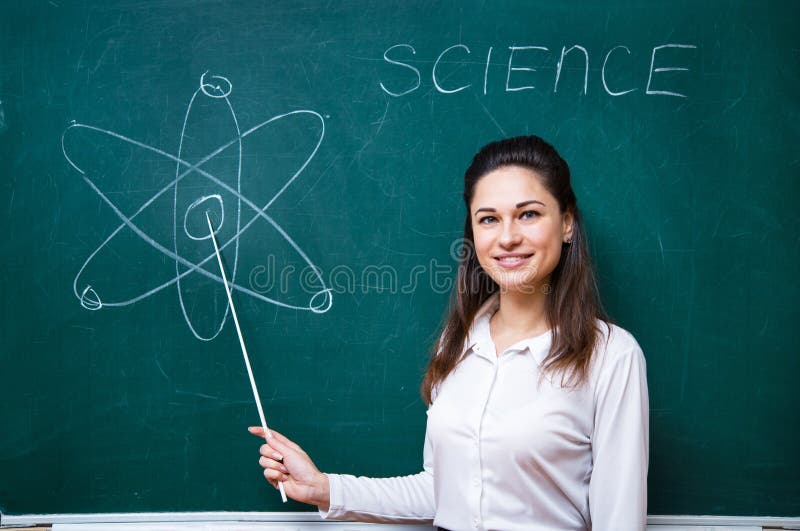 Young teacher talks about science near blackboard stock photos Young teacher talks about science near blackboard stock photos