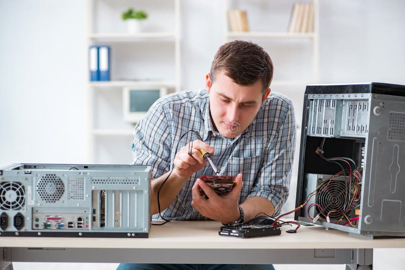 The Young Technician Repairing Computer in Stock Image Image