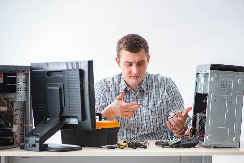 The Young Technician Repairing Computer in Stock Image Image