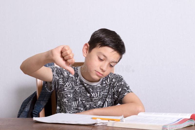 Young teenage boy doing his homework stock image Young teenage boy doing his homework stock image