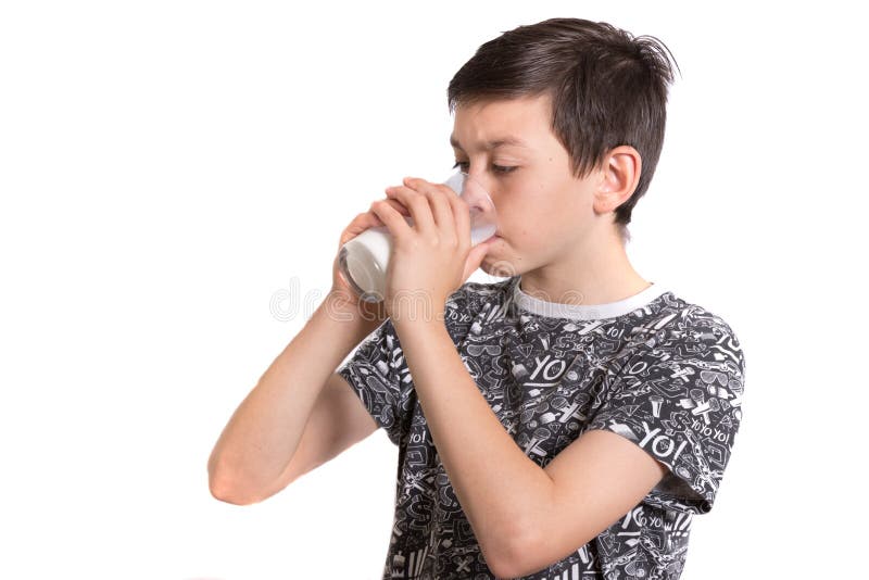 Young teenage boy drinking milk royalty free stock photography.