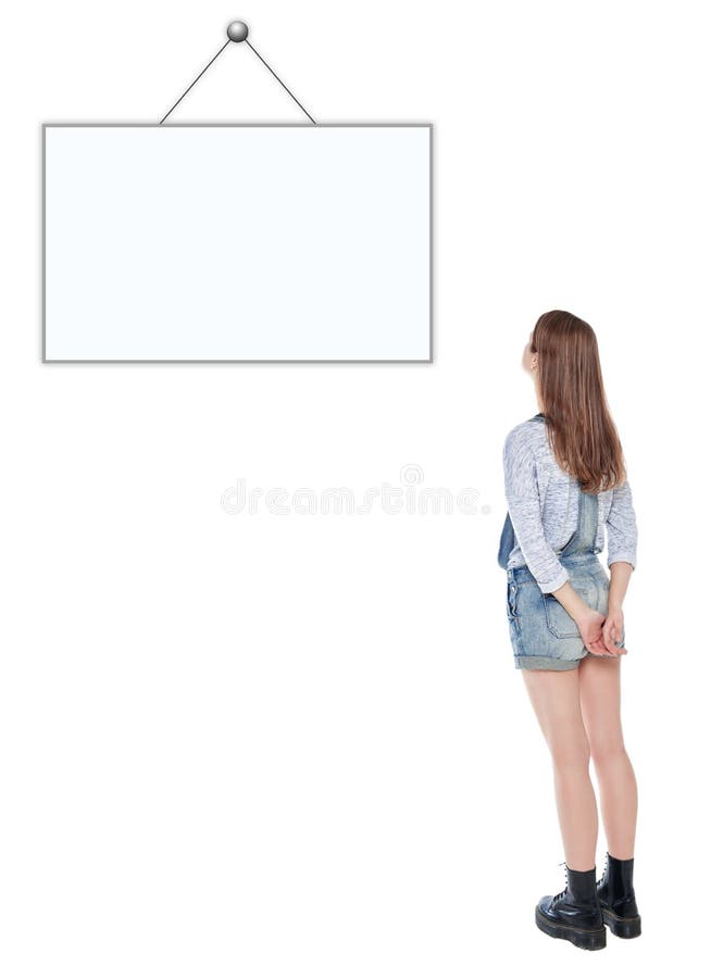 Young teenage girl standing and looking on empty picture frame stock image Young teenage girl standing and looking on empty picture frame stock image