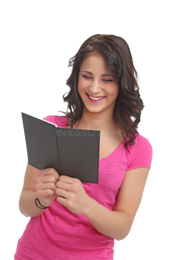 Young teenager with a book laughing