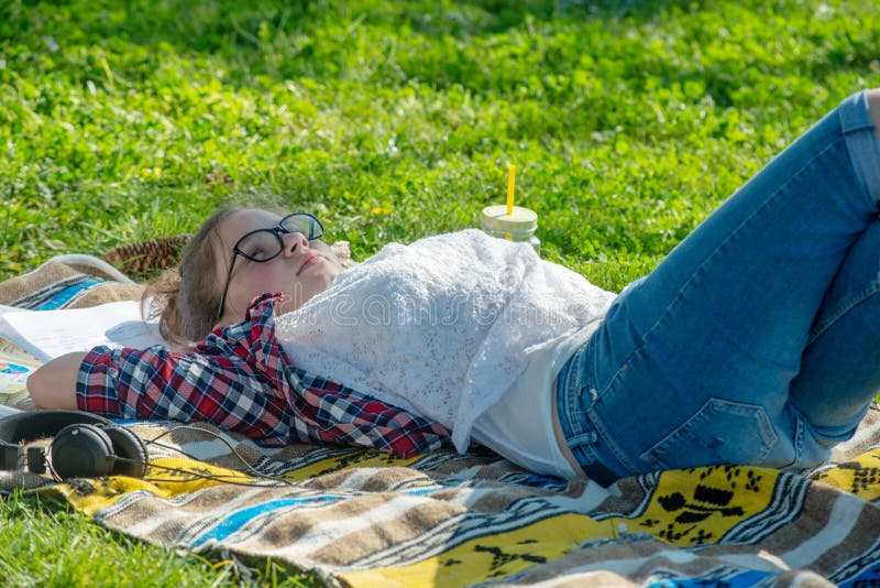 Young teenager girl lying in the grass royalty free stock photo Young teenager girl lying in the grass royalty free stock photo