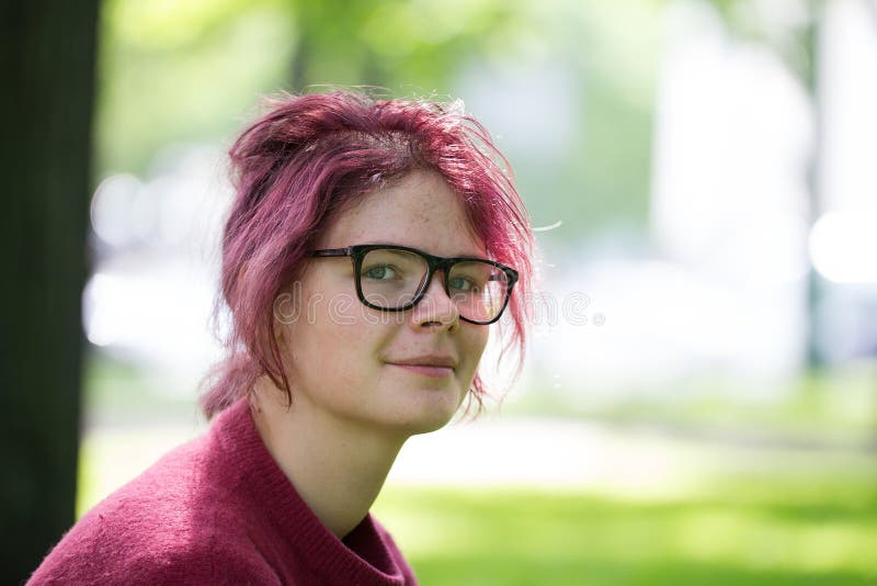 Young teenager girl with pimply face in a summer city park royalty free stock photography Young teenager girl with pimply face in a summer city park royalty free stock photography