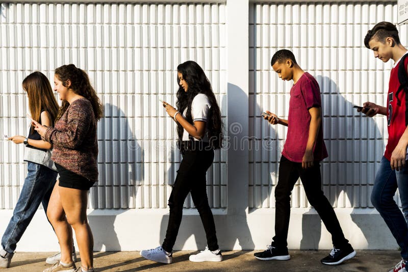 Young teenager looking into their phone