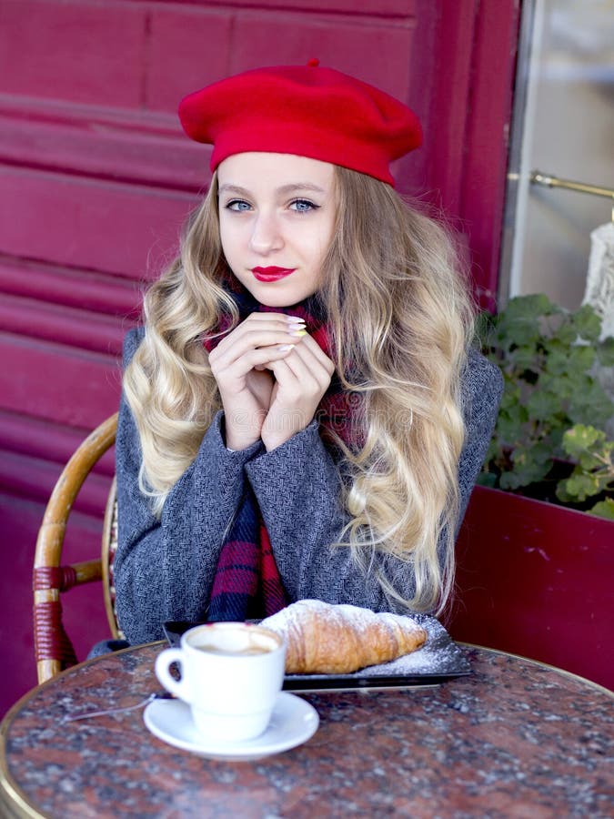 Tender Girl in a Red Beret Sits at a Table and Drinks Coff Xxx Pic Hd