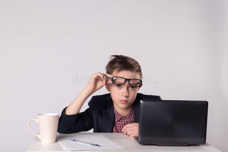 Young tired business boy in suit and eyeglasses