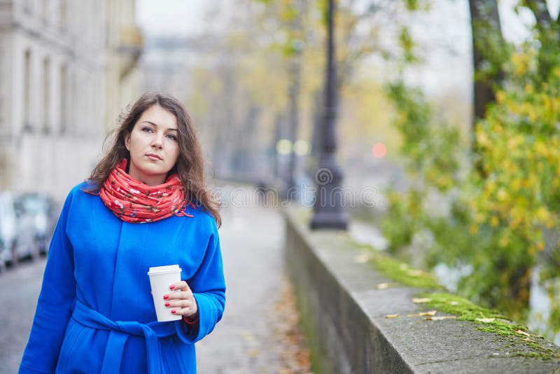 Young tourist in Paris on a fall day, drinking coffee to go stock photos Young tourist in Paris on a fall day, drinking coffee to go stock photos