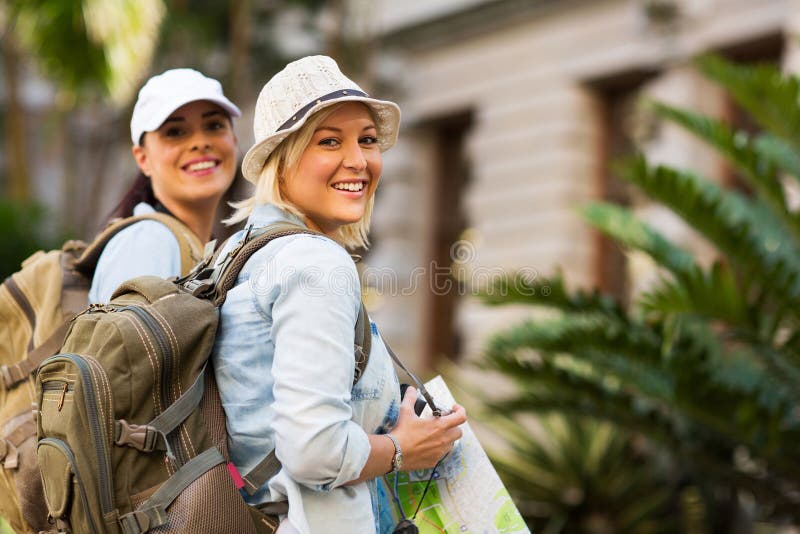 Beautiful young tourists looking at the camera