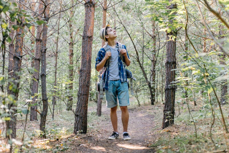 Young Traveler Guy Hiking with Backpack in the Nature Stock Image