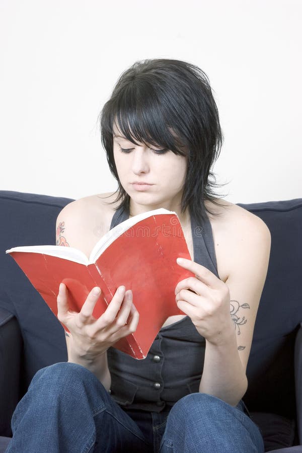 Young trendy woman reading a book