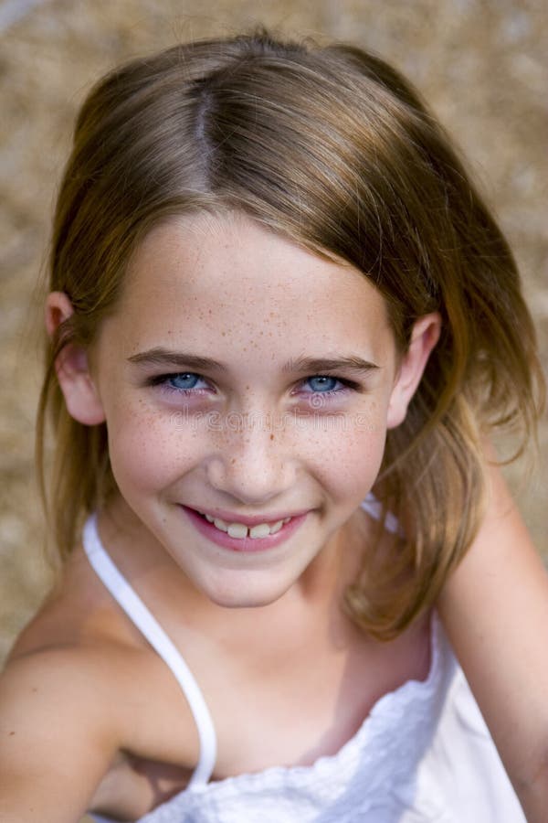 Young tween girl looking up