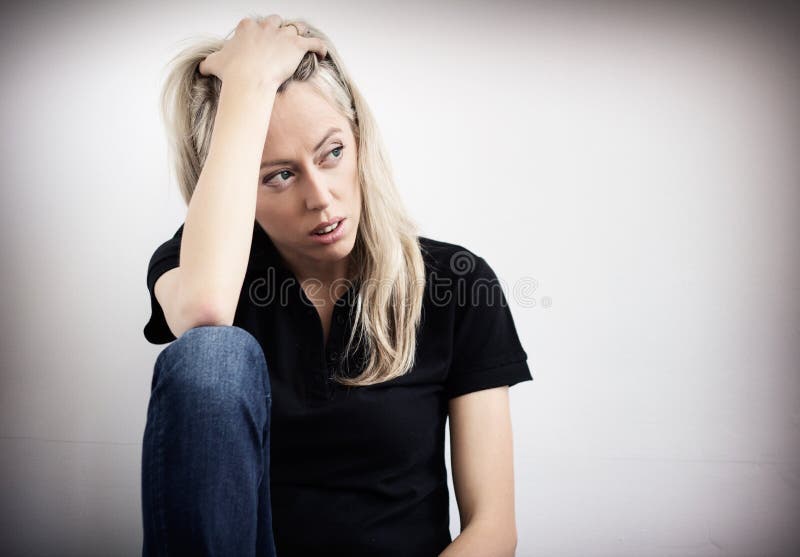 Young unhappy woman in depression stock image
