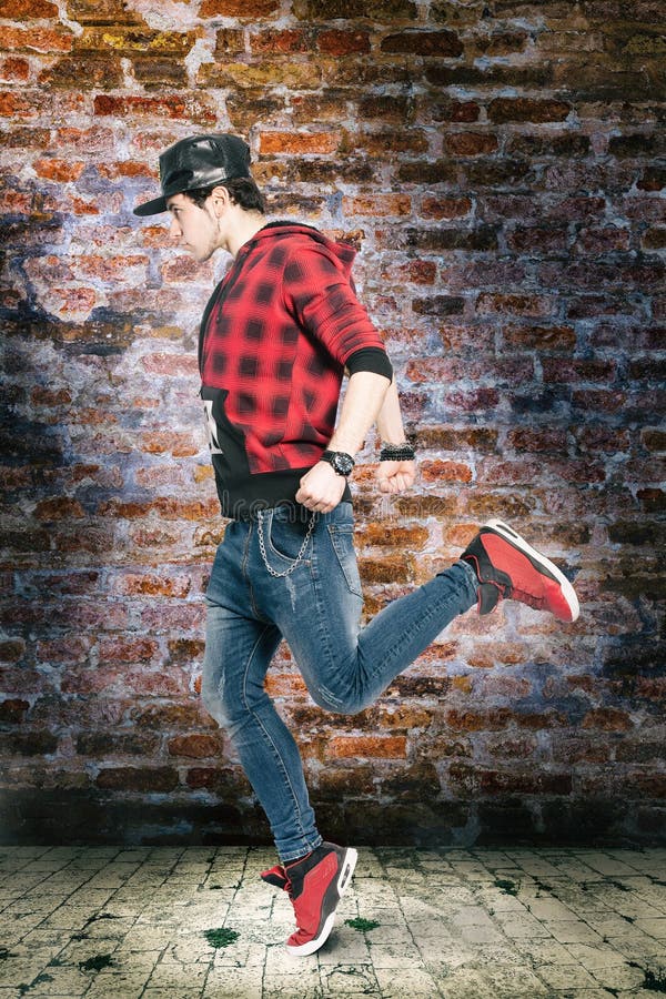 Young urban street dancer. Dancing in the city scene royalty free stock image Young urban street dancer. Dancing in the city scene royalty free stock image