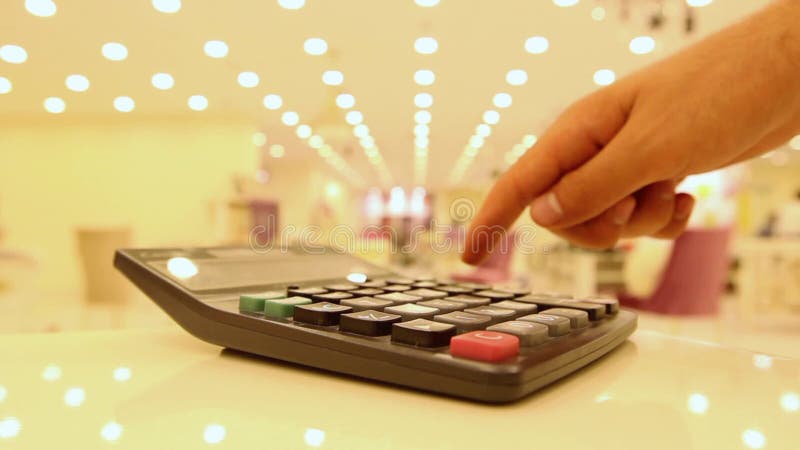 Young using calculator with finger stock video