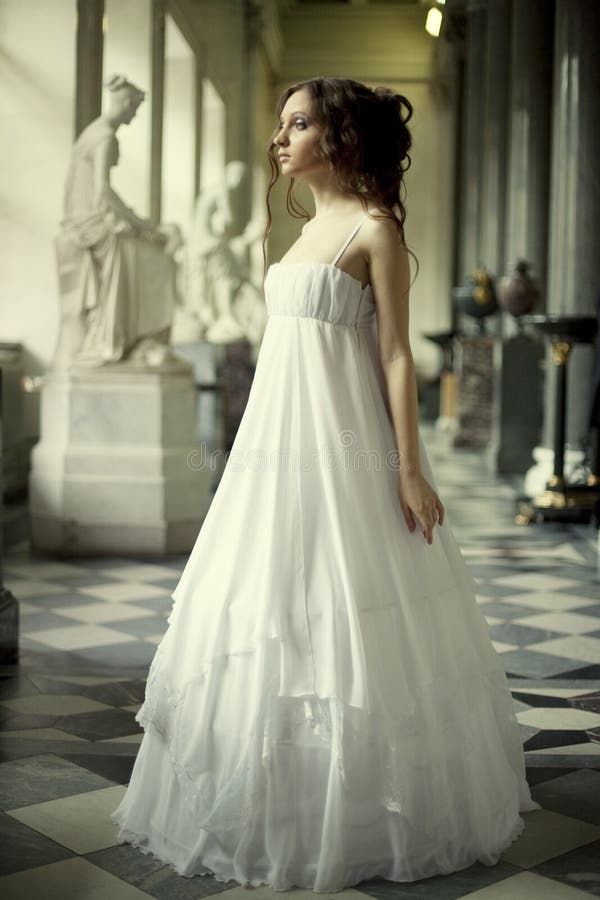 Young victorian lady in white dress