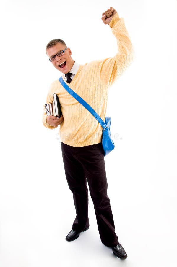 Young victorious student carrying bag and books