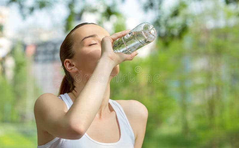 Young vitality woman drinking water