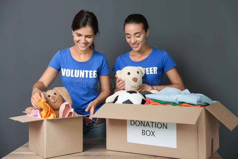 Young Volunteers Collecting Donations at Table Stock Photo Image of