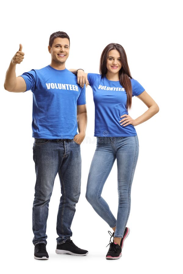 Young volunteers posing and showing thumbs up stock image Young volunteers posing and showing thumbs up stock image