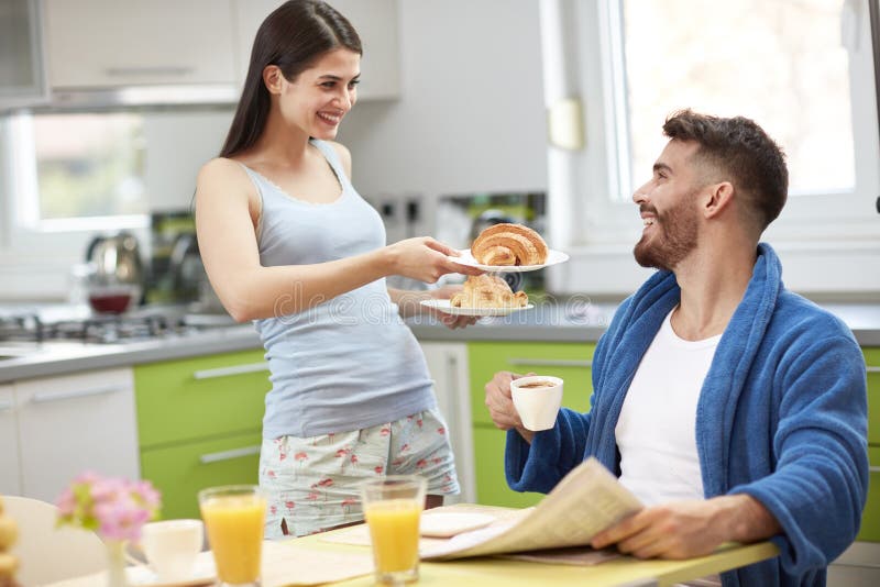 Young Wife Serving Breakfast Stock Photo - Image of love, couple: 100047436