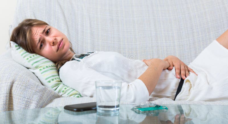Young woman with abdominal pain royalty free stock images Young woman with abdominal pain royalty free stock images