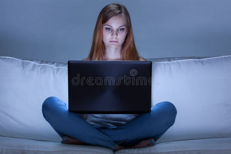 Young woman addicted to computer stock images