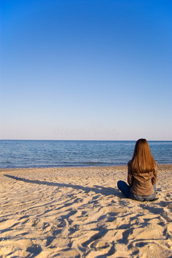 A Young Woman Alone at the Seaside Stock Image - Image of khaki, alone ...