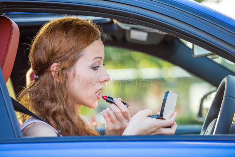Young Woman Applying Makeup while Driving Car Stock Image Image of