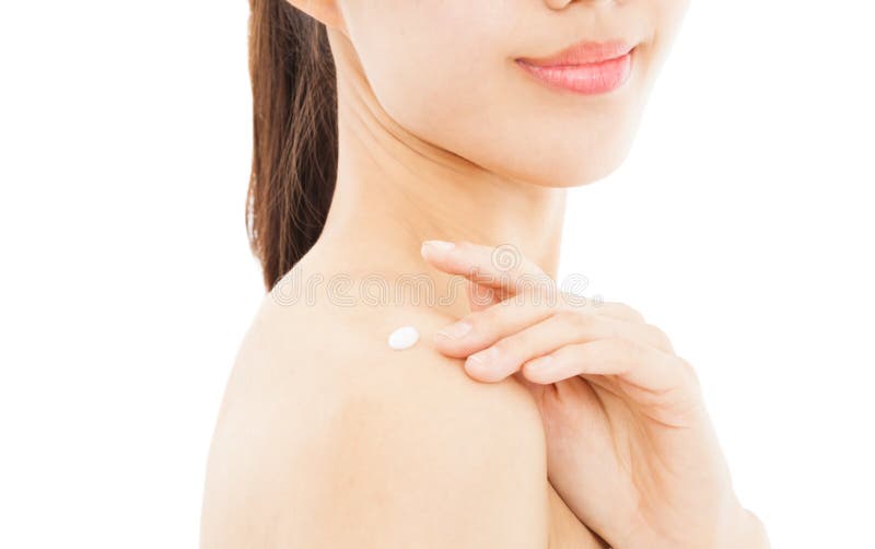 Young woman applying moisturize cream