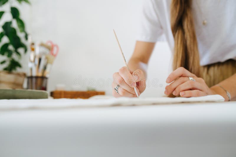 Young Woman Artist Drawing on Sheet, Behind the Table at Home. Stock ...