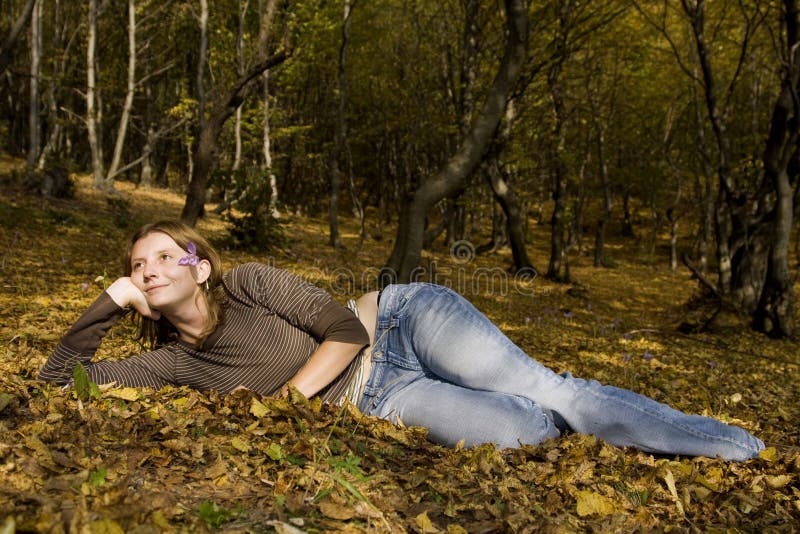 Young woman in autumn forest