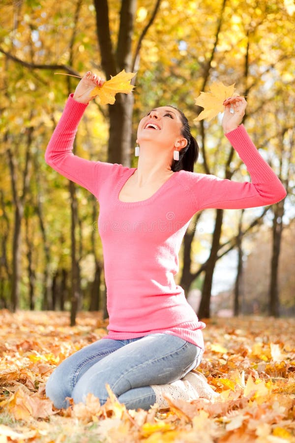 Young woman in the autumn park