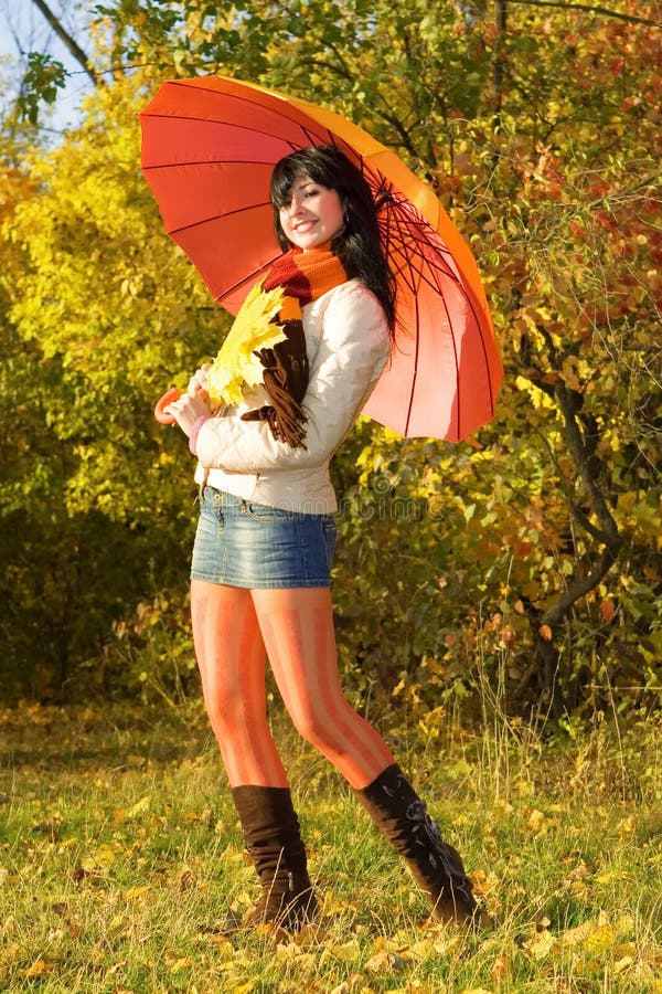 Young woman in the autumn park