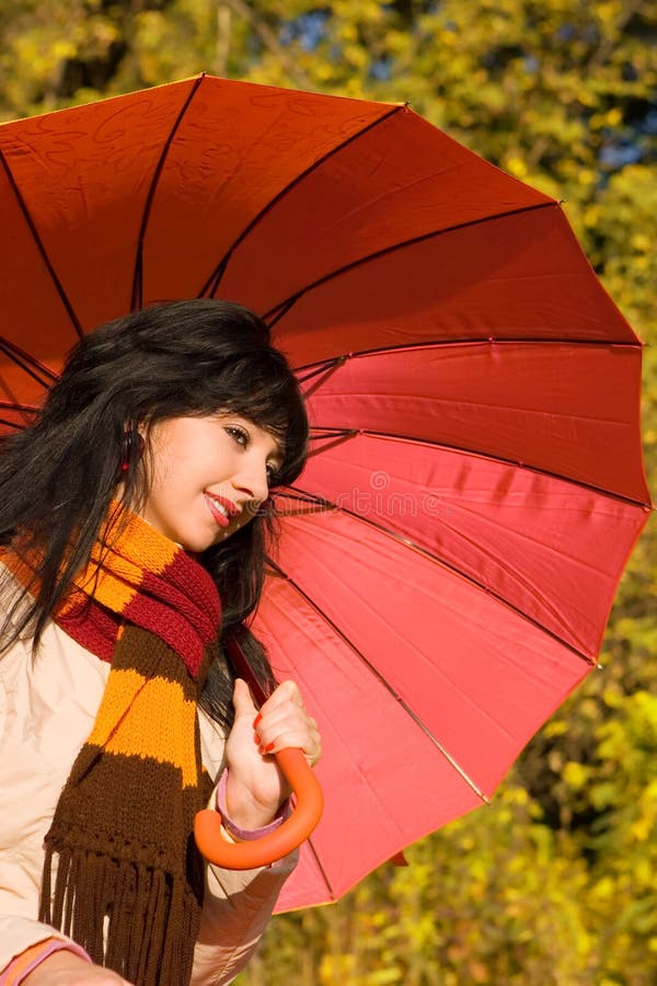 Young woman in the autumn park