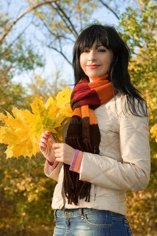 Young woman in the autumn park