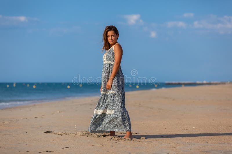 YOUNG WOMAN on a BEACH stock image. Image of beach, contemplate - 181990257