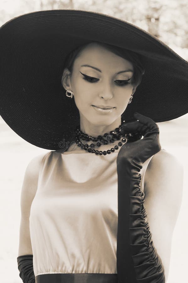 Young woman in black hat