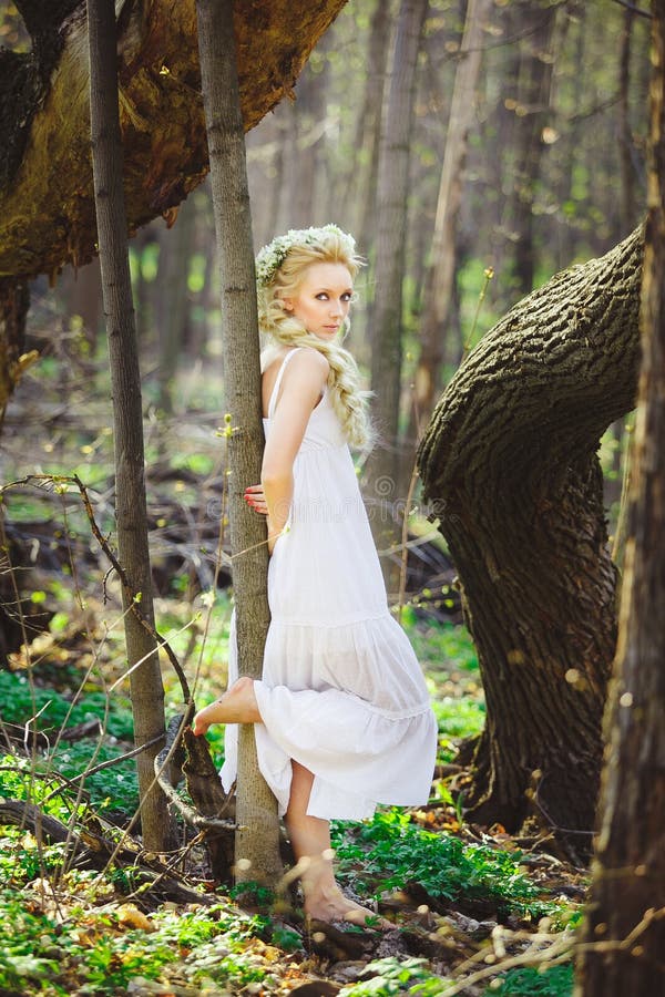 Young Woman with Blond Hair in White Dress Forest among Trees. Stock ...