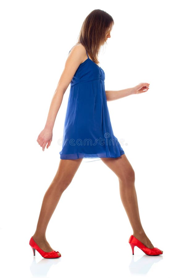 Young woman with blue dress and red shoes