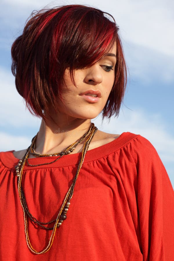 Young woman on a blue sky