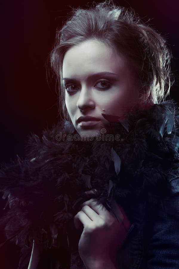 Young woman in boa stock photography