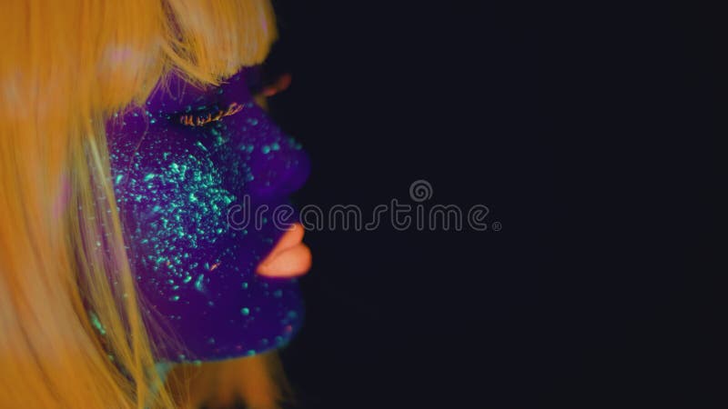 Women Portrait With Glowing Colored Makeup In Black Light Stock