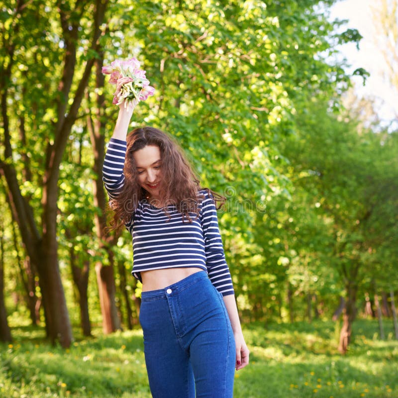 Beautiful Girl With Flowers Tulips In Hands Outdoors Stock Photo ...