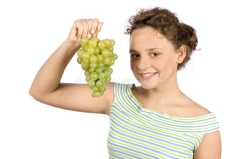 Young woman with bunch of grapes