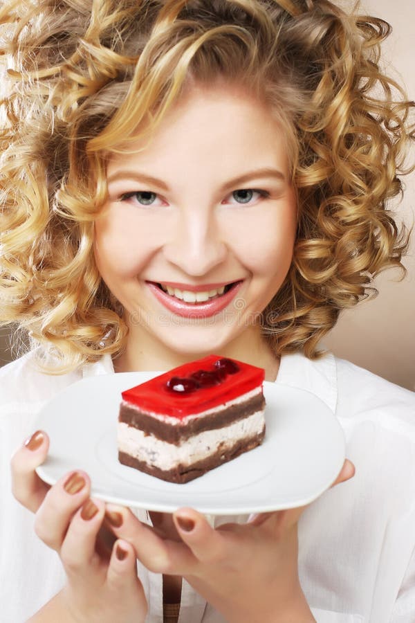 Young woman with a cake stock photo. Image of mouth 191735174