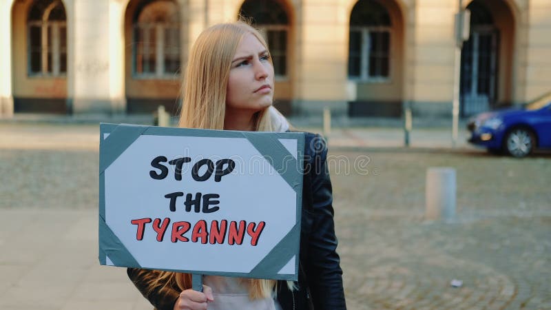 Young woman calling to stop the tyranny by holding steamer