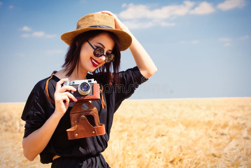 Young woman with camera