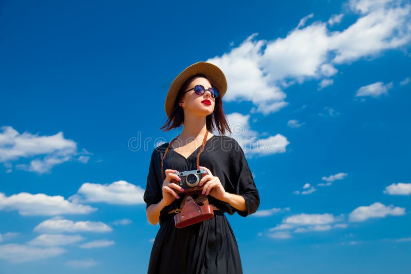 Young woman with camera